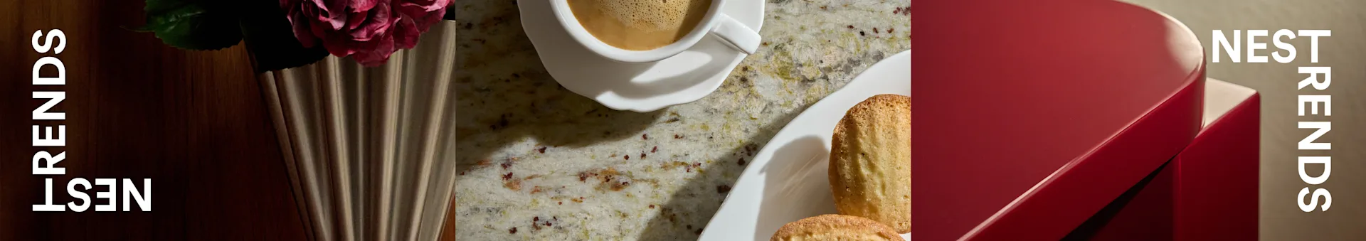 Kaffekop, madeleinekager og en rose i riflet vase på spættet bordplade ved siden af rød æske med teksten 'NEST TRENDS'.