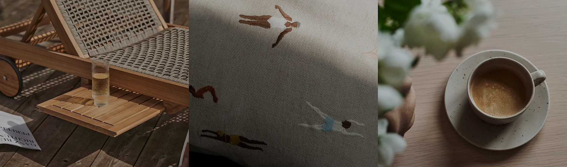 En liggestol med en drink, en broderet pude med svømmere og en kaffekop med hvide blomster.